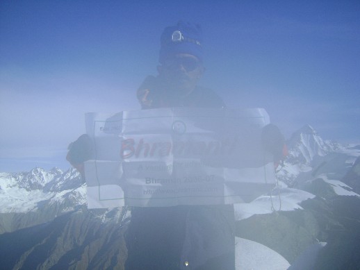 Kaivalya holding Bhramanti's Banner on the Summit at 17500 ft